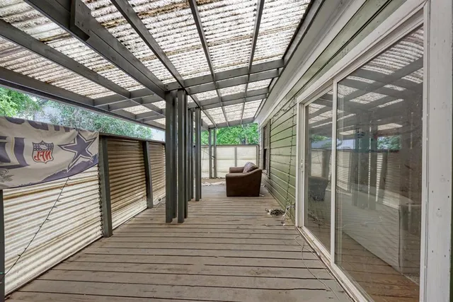 a balcony with furniture and a window