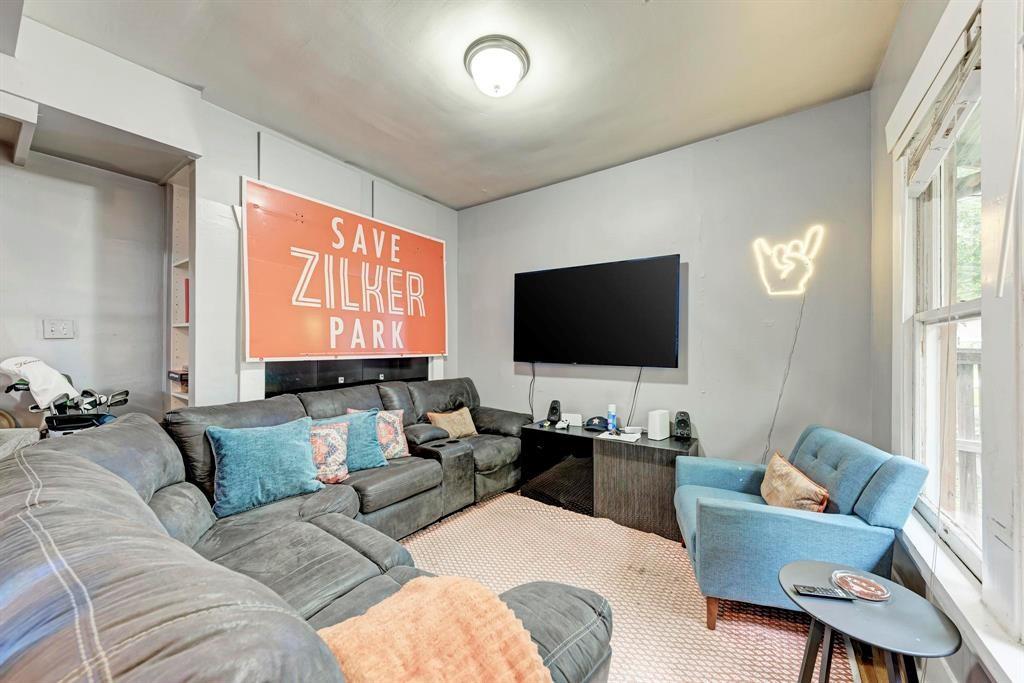 2834 Salado Street Austin, TX 78705 - Photo 5 of 40 a living room with furniture and a flat screen tv