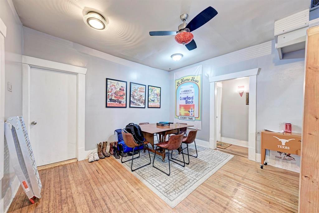 2834 Salado Street Austin, TX 78705 - Photo 6 of 40 a view of a dining room with furniture and wooden floor