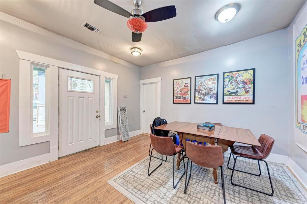 2834 Salado Street Austin, TX 78705 - Photo 7 of 40 a dining room with wooden floor and a ceiling fan