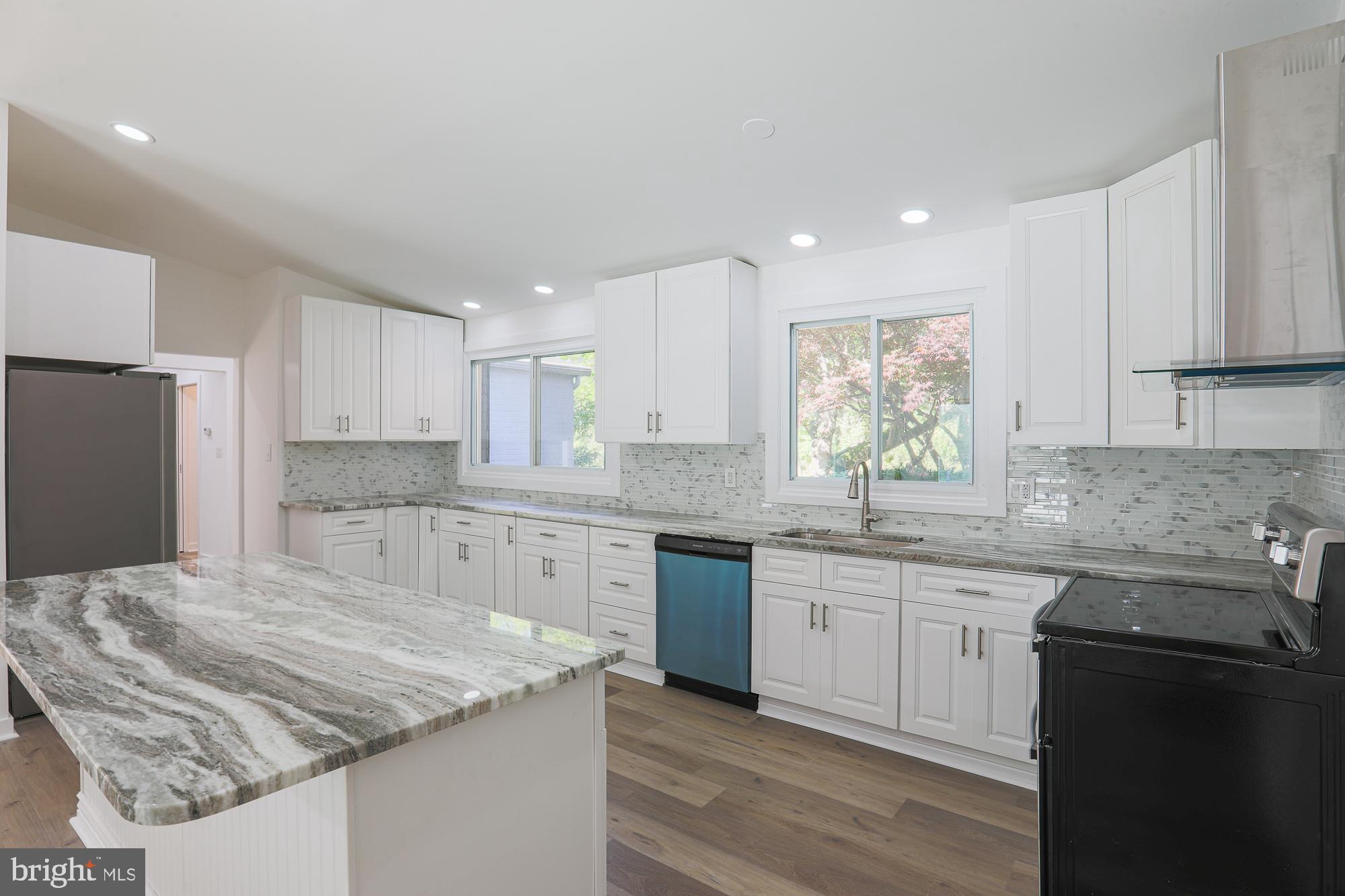 8315 Stevenson Road Baltimore, MD 21208 - Photo 4 of 62 Bright white kitchen with new stainless appliances