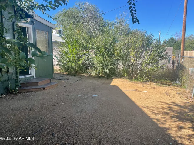 a view of a backyard of the house