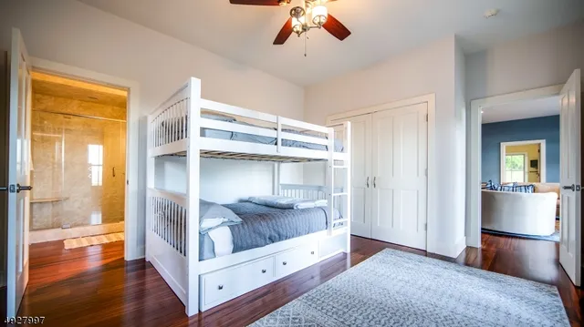 a view of room with furniture and wooden floor