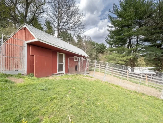 a house with trees in the background