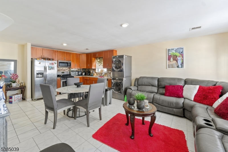 22 Godwin Avenue Paterson, NJ 07501 - Photo 3 of 16 a living room with furniture and kitchen view