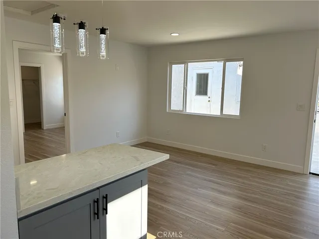 a kitchen with stainless steel appliances granite countertop a sink and a stove