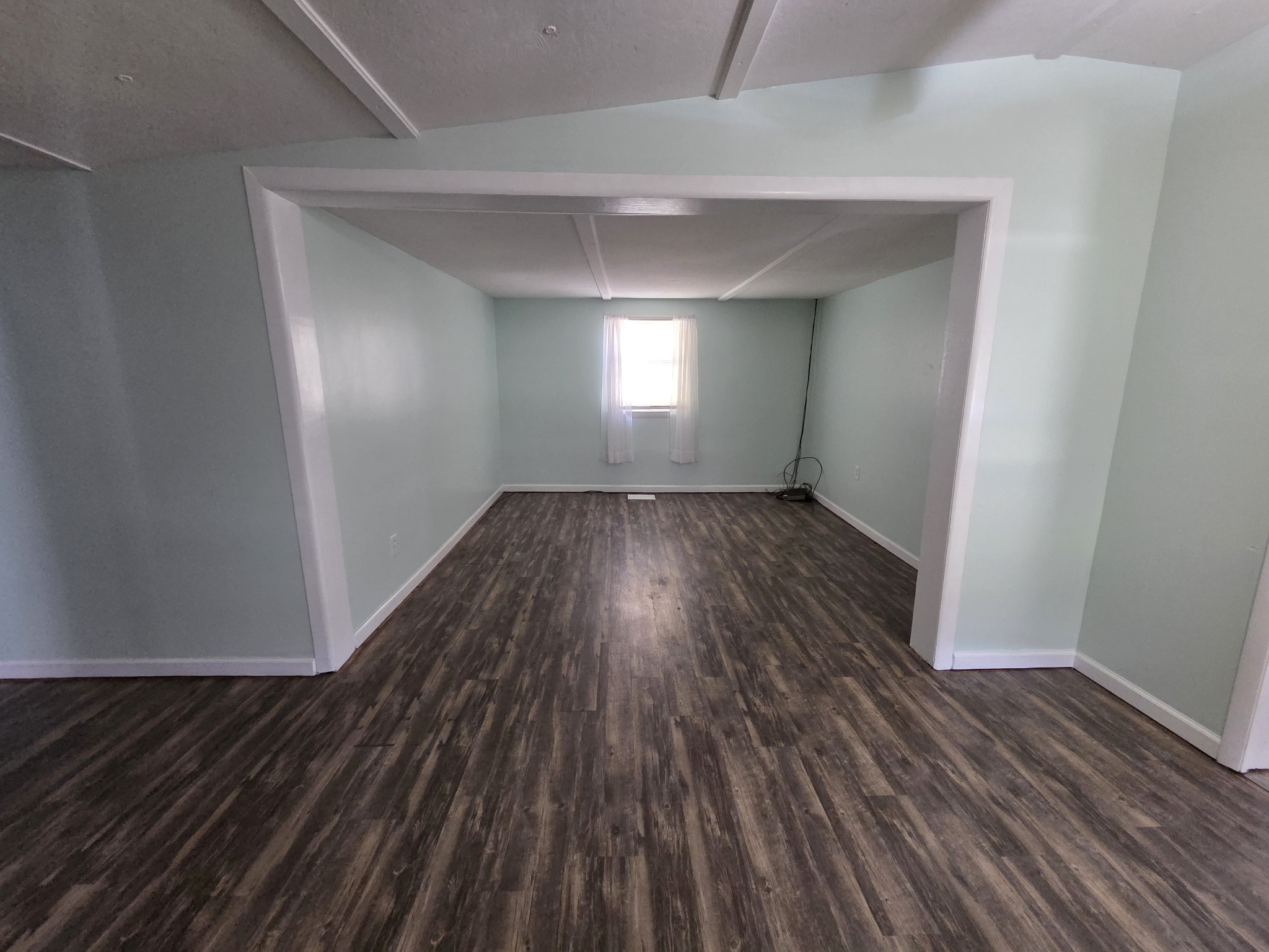 65 Anthony Mill Road Tullahoma, TN 37388 - Photo 16 of 43 an empty room with wooden floor and windows