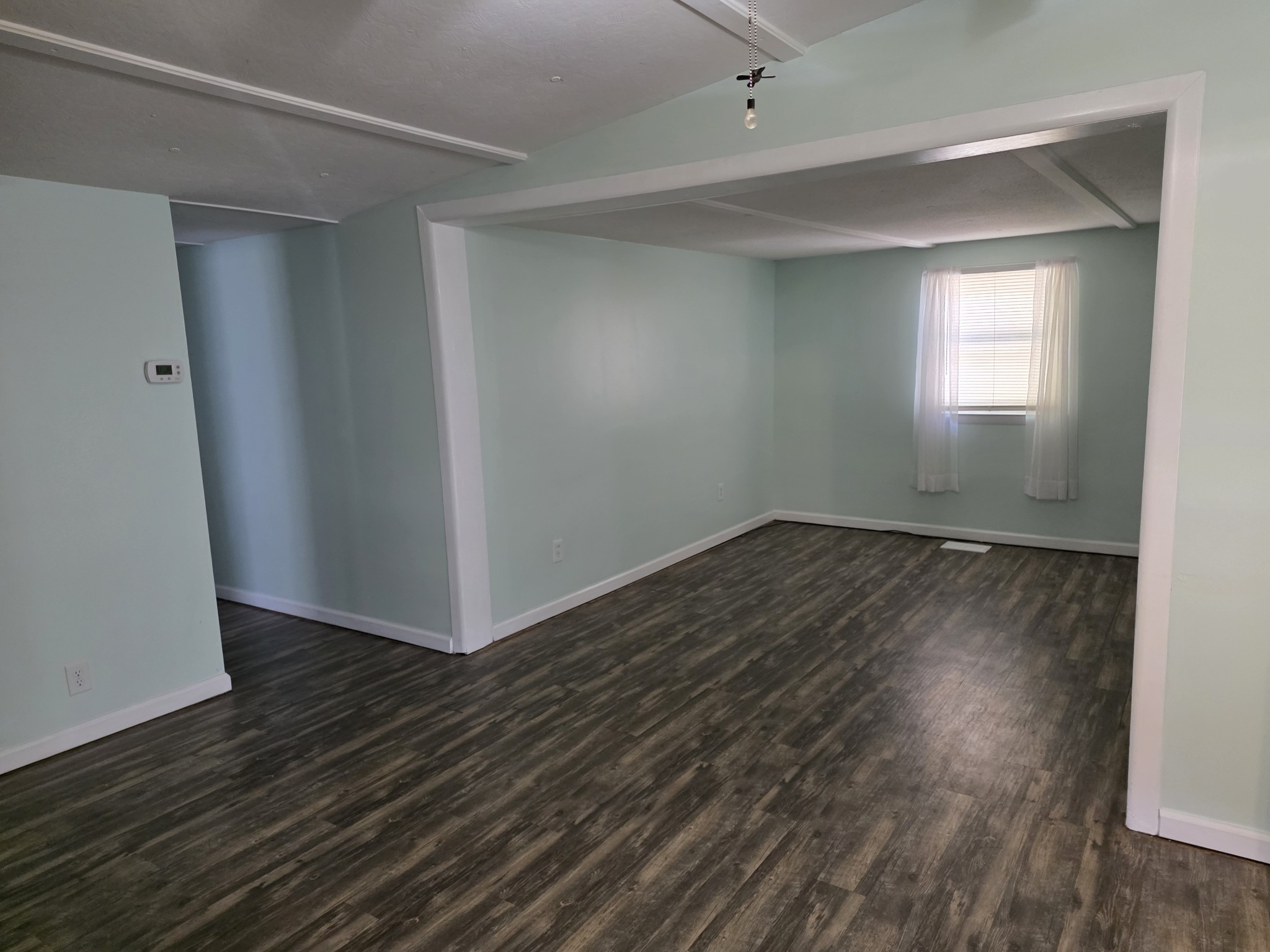 65 Anthony Mill Road Tullahoma, TN 37388 - Photo 17 of 43 an empty room with wooden floor and windows