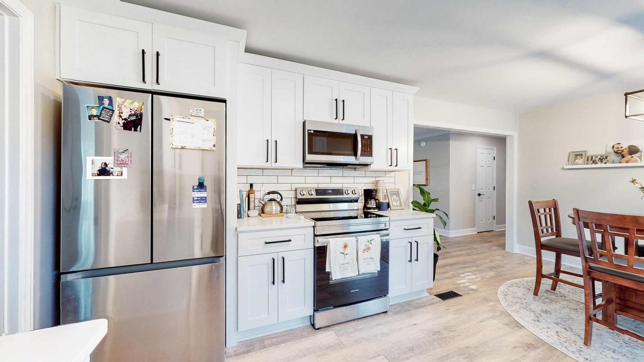 506 Thatcher Trace Murfreesboro, TN 37129 - Photo 8 of 22 a kitchen with stainless steel appliances granite countertop a refrigerator stove a sink and a microwave