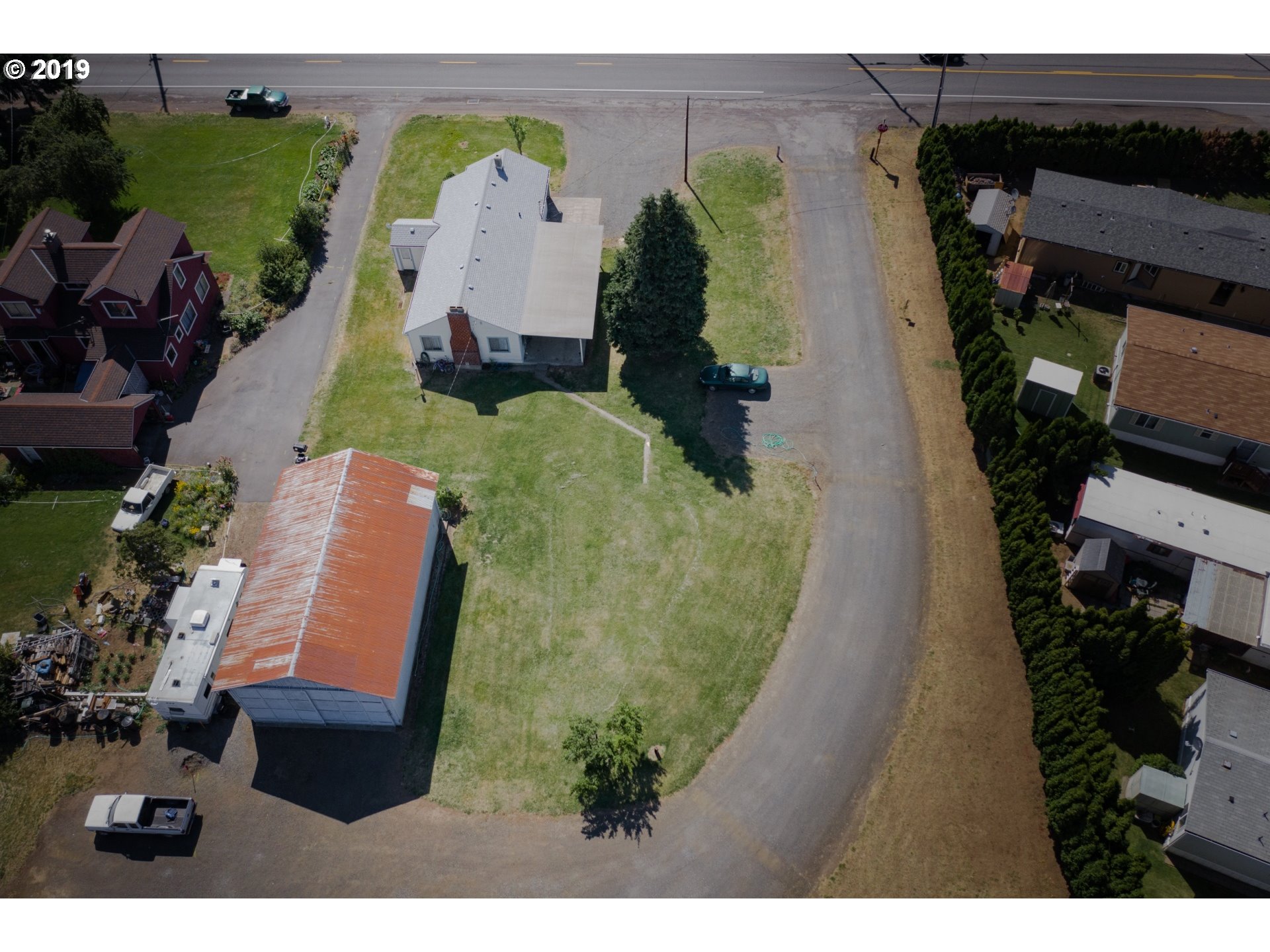 1285 Tucker Road Hood River, OR 97031 - Photo 3 of 32 an aerial view of a house with a garden and plants
