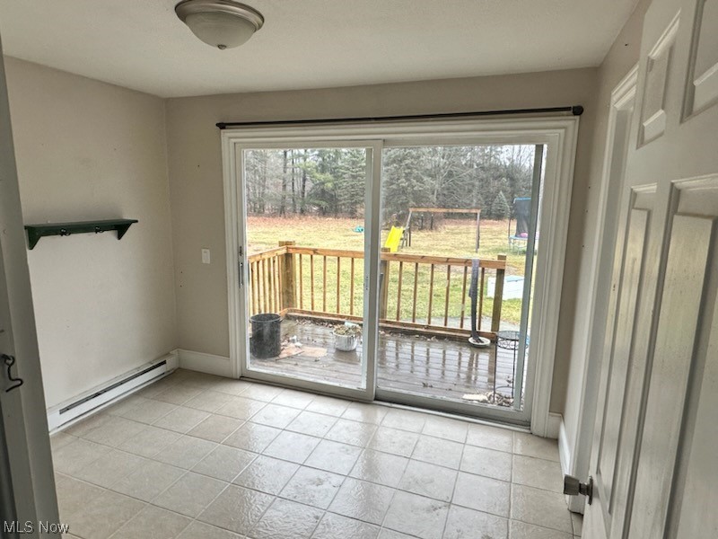 4396 Rootstown Road Rootstown, OH 44272 - Photo 16 of 21 Entryway featuring a baseboard heating unit, a wealth of natural light, and light tile flooring