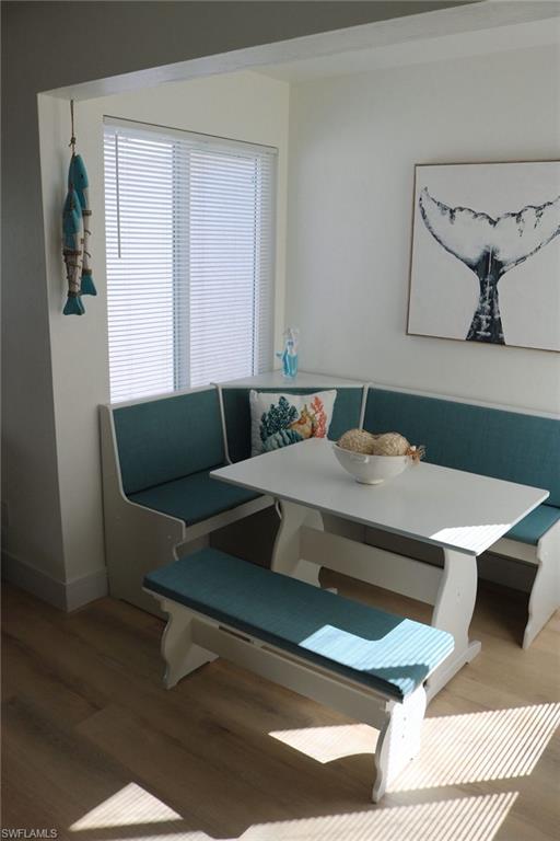 2235 San Marco Road, Unit 5204 Marco Island, FL 34145 - Photo 6 of 34 Built-in banquette seating with teal cushions and white wood-finish construction