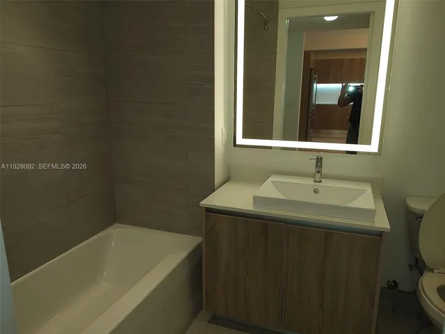 a bathroom with a sink and a bathtub