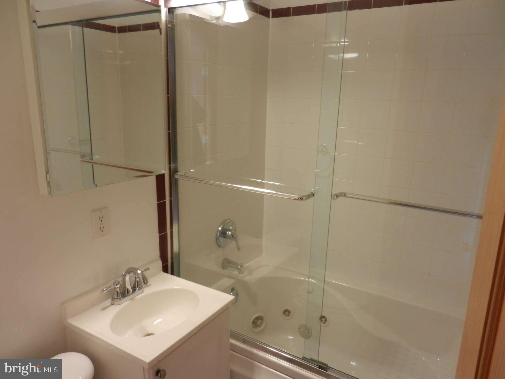 3110 Cornwall Road Baltimore, MD 21222 - Photo 20 of 28 a bathroom with a sink toilet and shower