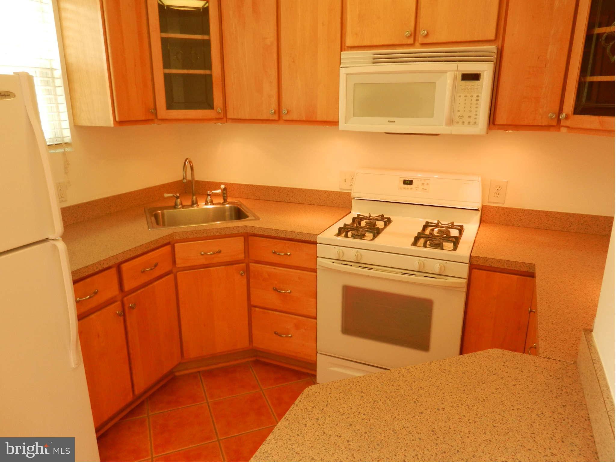 3110 Cornwall Road Baltimore, MD 21222 - Photo 3 of 28 a kitchen with stainless steel appliances granite countertop a sink stove and cabinets