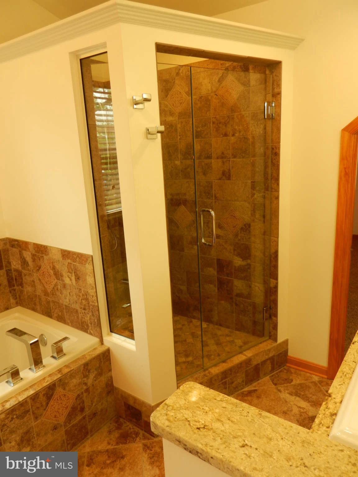 3110 Cornwall Road Baltimore, MD 21222 - Photo 6 of 28 a bathroom with a tub and a shower