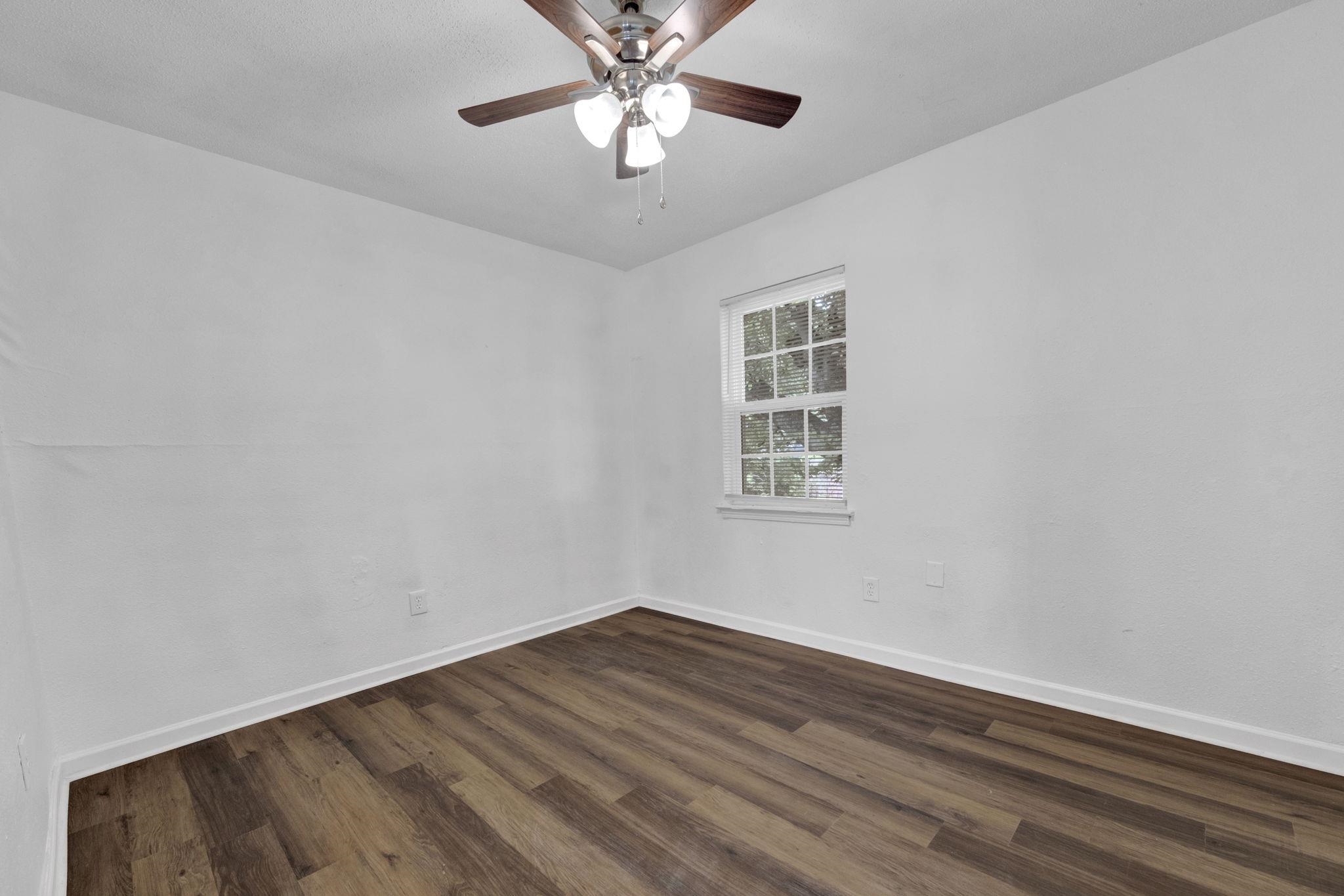 2966 Yale Avenue, Unit 3 Memphis, TN 38112 - Photo 11 of 24 Spare room featuring dark wood finished floors and ceiling fan