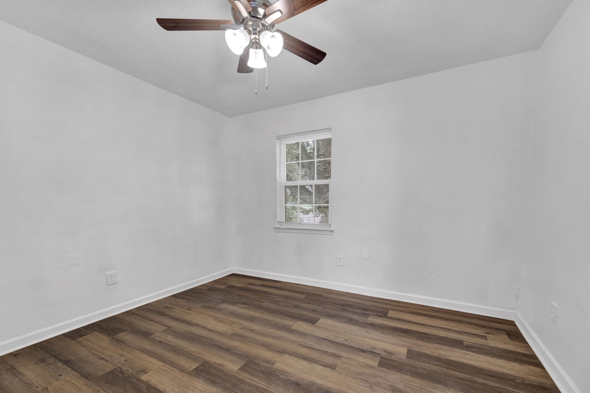 2966 Yale Avenue, Unit 3 Memphis, TN 38112 - Photo 12 of 24 Spare room with dark wood finished floors and ceiling fan