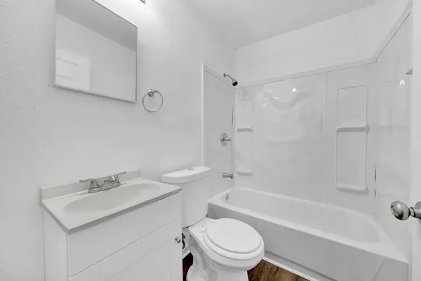 a bathroom with a sink a toilet and a bathtub