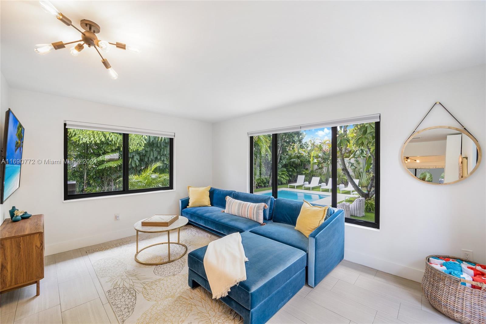 320 Southwest 24th Road Miami, FL 33129 - Photo 18 of 27 a living room with furniture and a flat screen tv