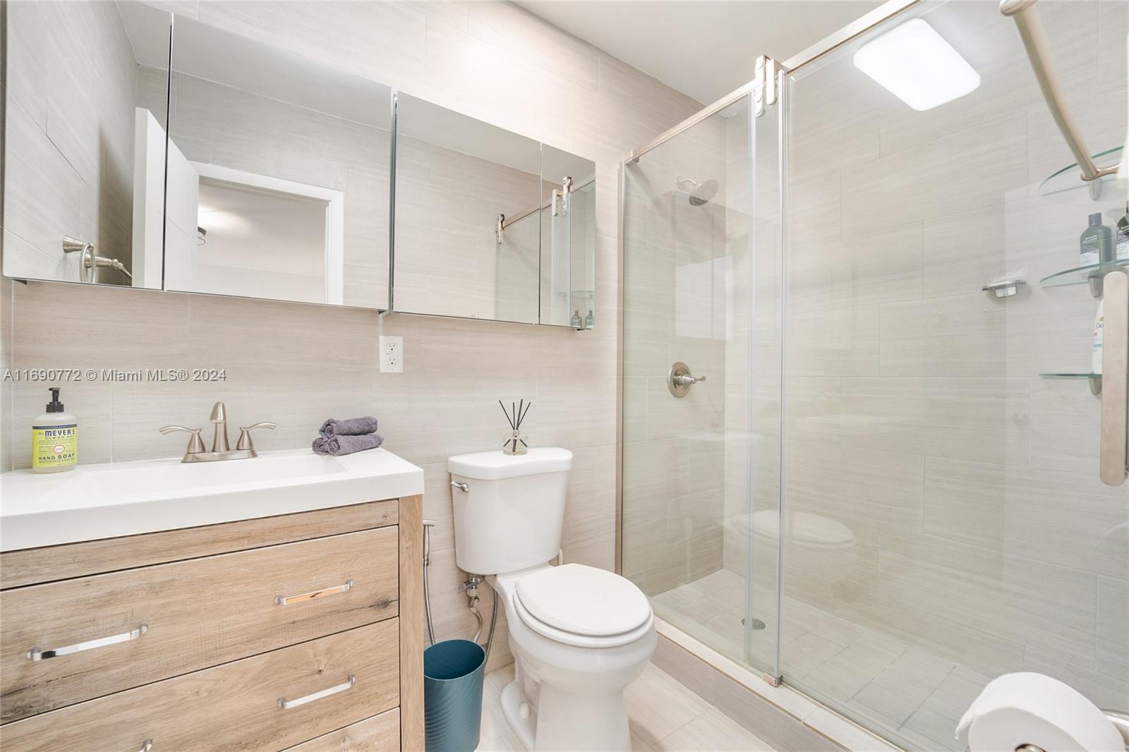 320 Southwest 24th Road Miami, FL 33129 - Photo 25 of 27 a bathroom with a sink toilet and shower