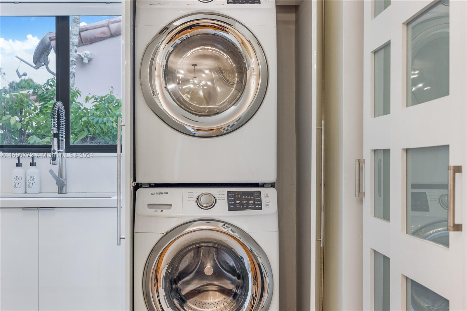 320 Southwest 24th Road Miami, FL 33129 - Photo 26 of 27 a close view of a bedroom with washer and dryer