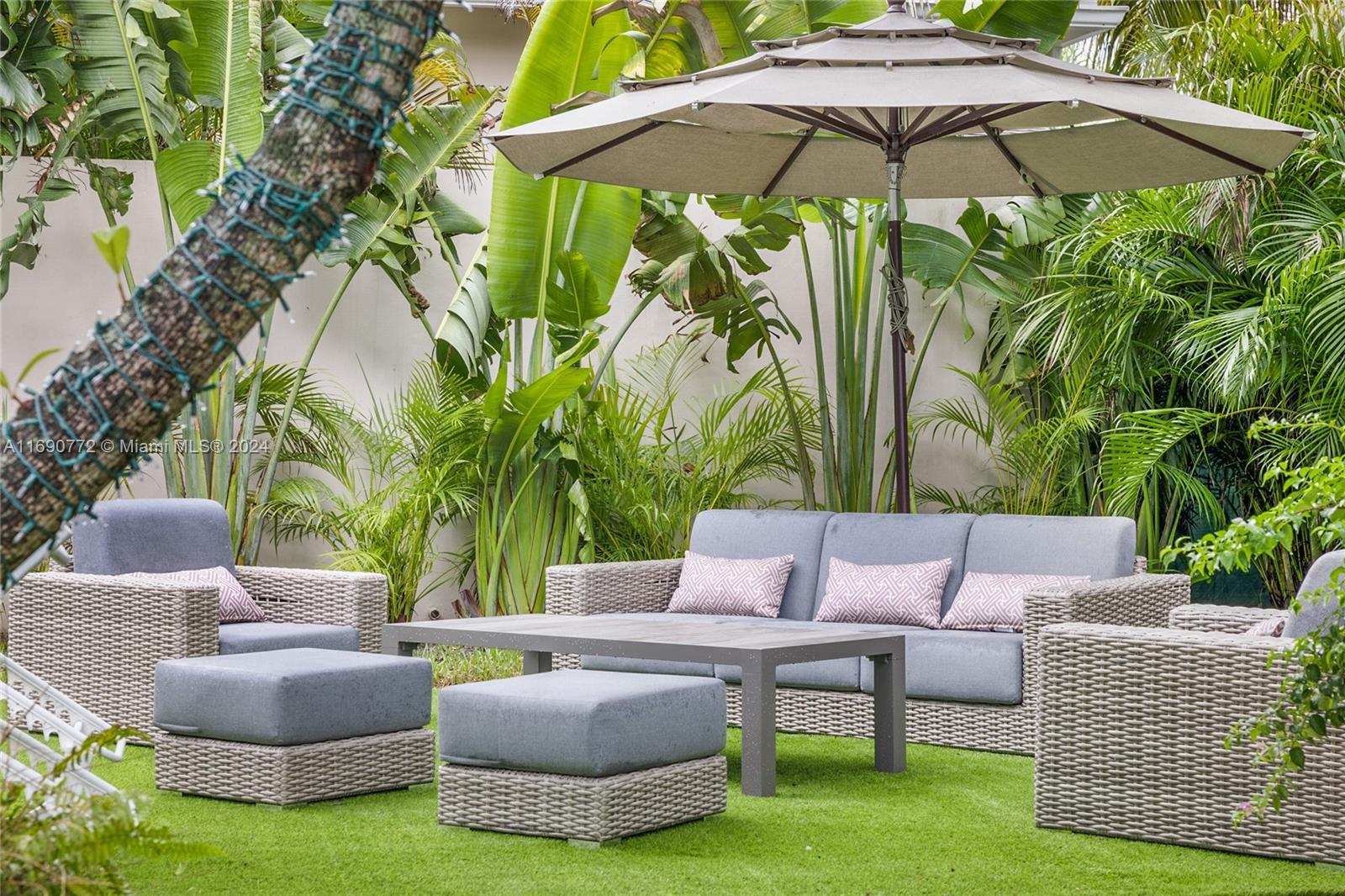 320 Southwest 24th Road Miami, FL 33129 - Photo 5 of 27 a view of a backyard with furniture and a small yard