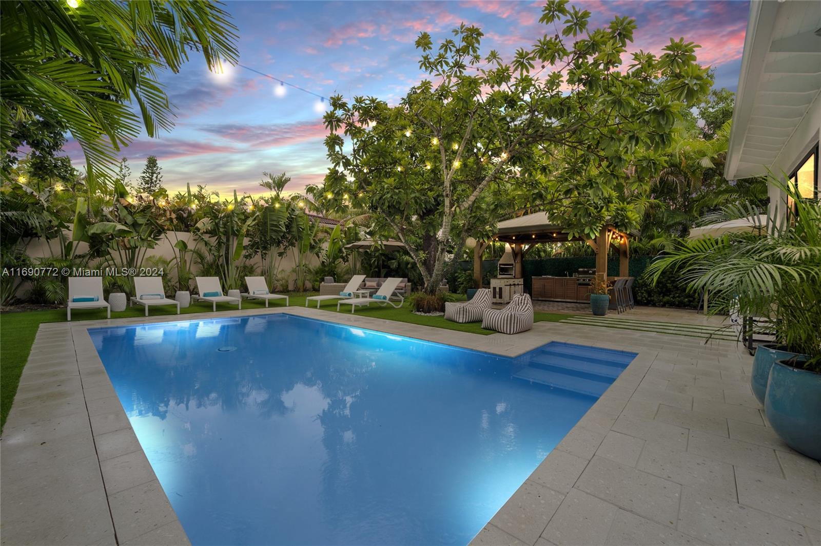 320 Southwest 24th Road Miami, FL 33129 - Photo 8 of 27 a view of a swimming pool with a patio