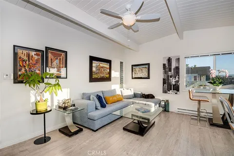 a living room with furniture or couch and a flat screen tv