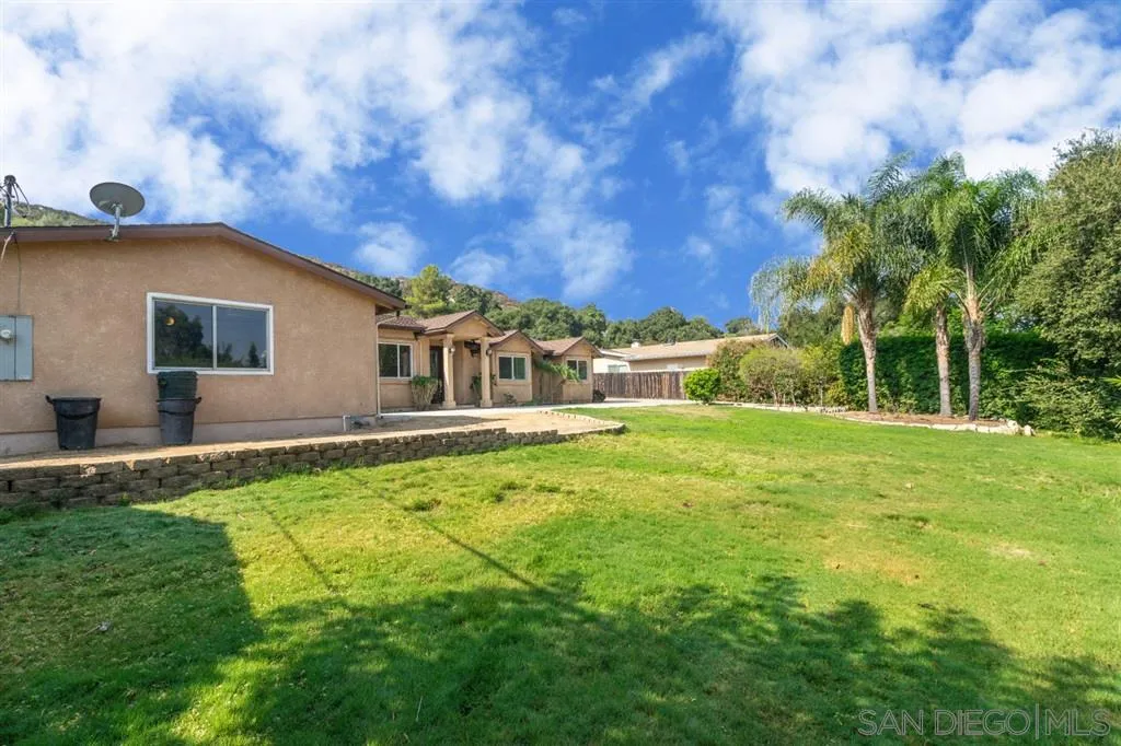 12841 Stone Canyon Road Poway, CA 92064 - Photo 24 of 25 a front view of house with yard and trees