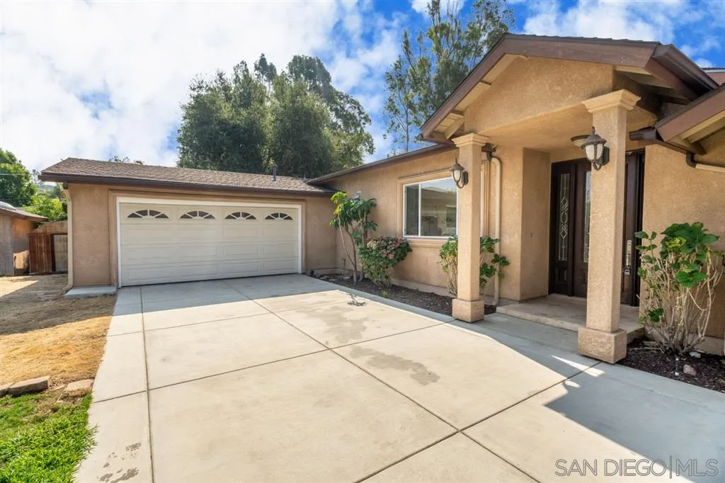 12841 Stone Canyon Road Poway, CA 92064 - Photo 25 of 25 a view of a white house with a outdoor space