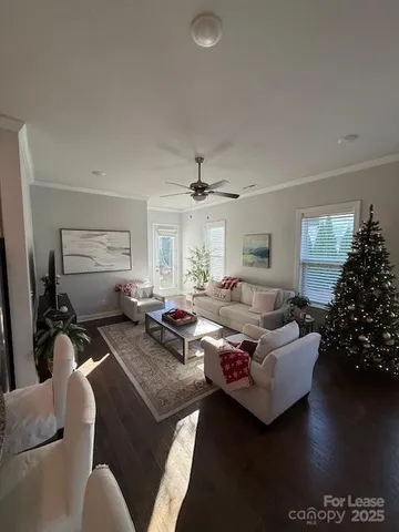 a living room with furniture window and wooden floor