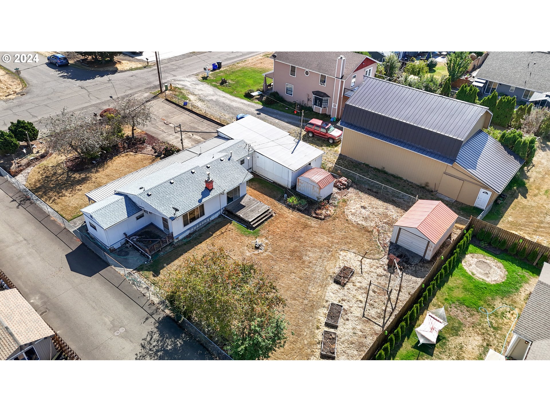 300 Ridings Avenue Molalla, OR 97038 - Photo 29 of 36 an aerial view of a house with a yard basket ball court and outdoor seating