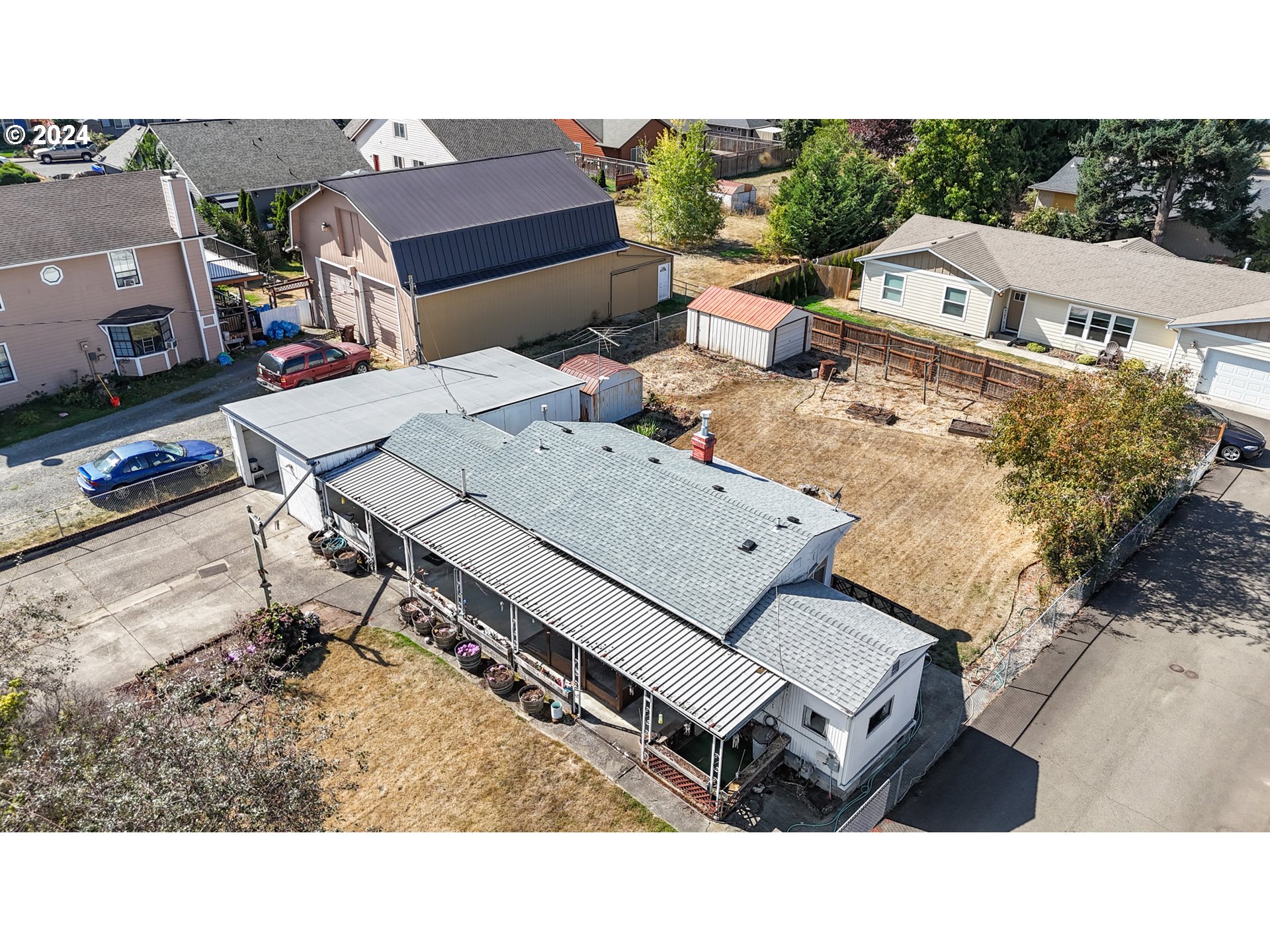 300 Ridings Avenue Molalla, OR 97038 - Photo 31 of 36 a aerial view of a house with table and chairs