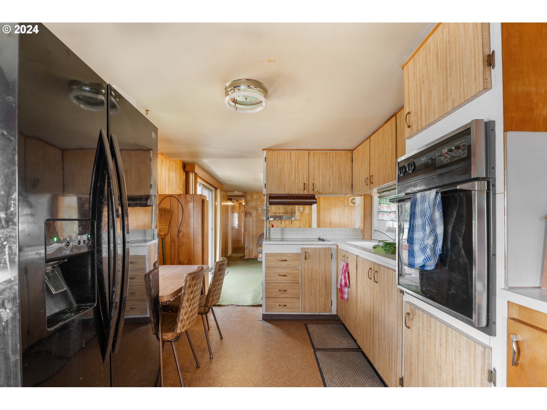 300 Ridings Avenue Molalla, OR 97038 - Photo 5 of 36 a open kitchen with a sink and refrigerator