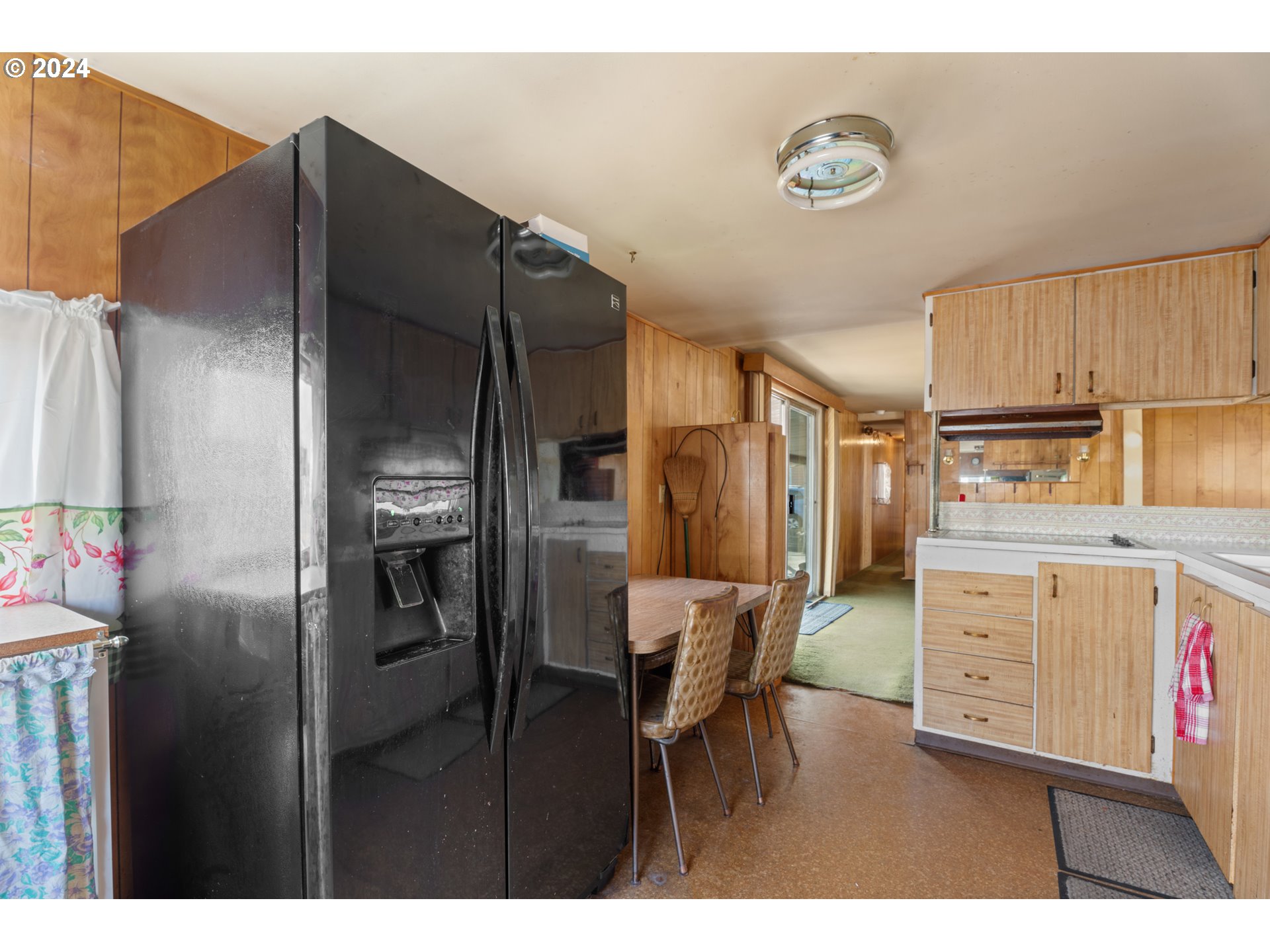 300 Ridings Avenue Molalla, OR 97038 - Photo 6 of 36 a kitchen with cabinets and stainless steel appliances