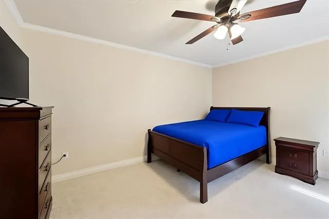 a blue bed sitting in a room next to a window