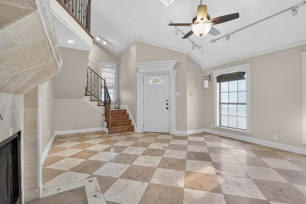 272 Lodge Road Coppell, TX 75019 - Photo 6 of 24 a view of a hallway with a chandelier fan and windows