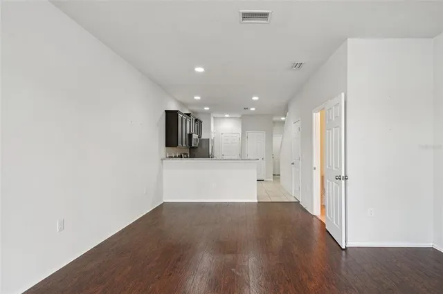 a view of kitchen and wooden floor