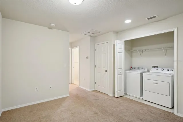 an empty room with a empty space and windows