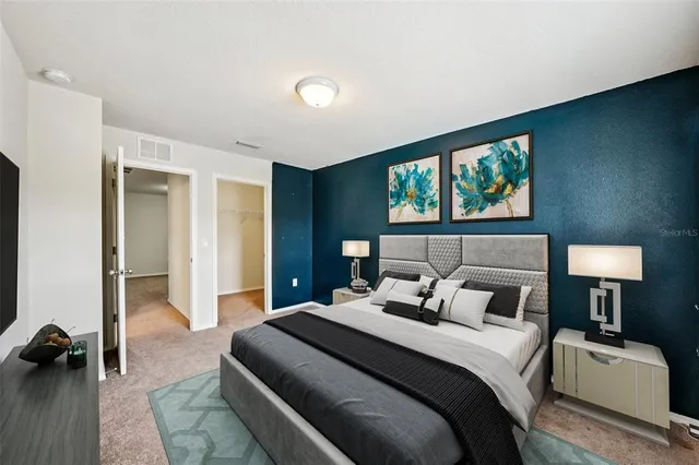 an empty room with closet and bathroom