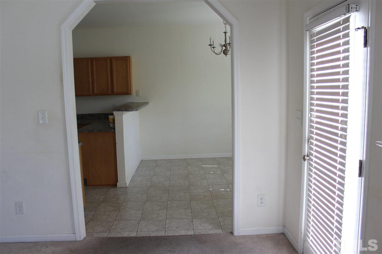 8518 Boysenberry Lane Raleigh, NC 27616 - Photo 13 of 17 a view of hallway with washer and dryer