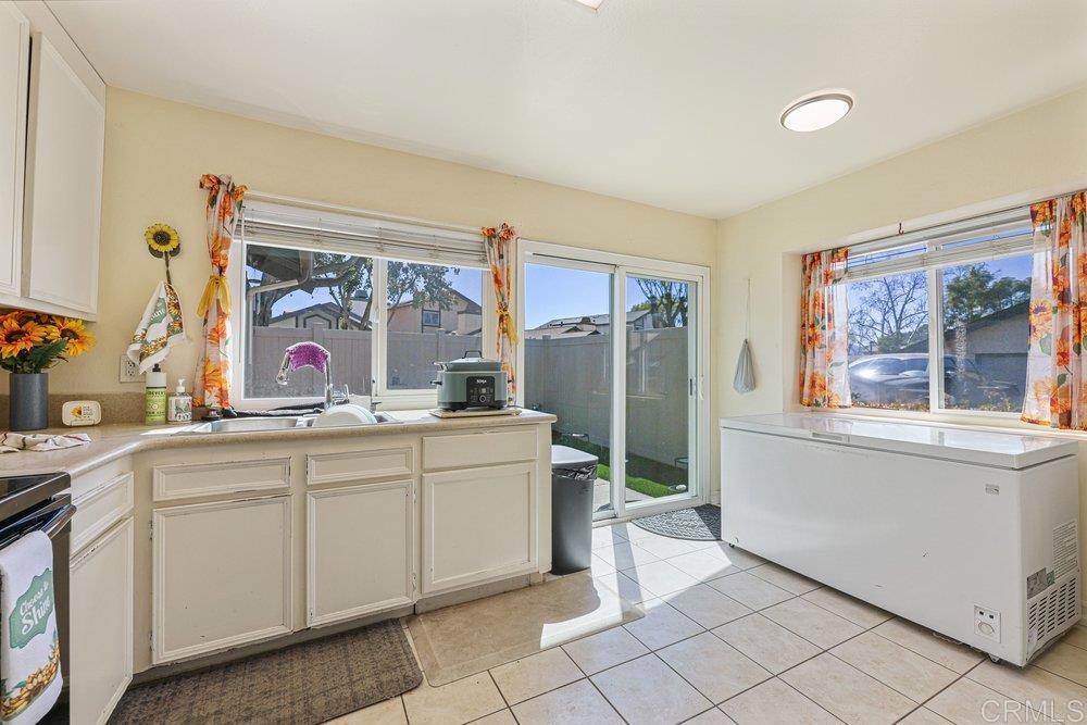 10385 Seth Way Santee, CA 92071 - Photo 9 of 33 a bathroom with a sink mirror and a bathtub