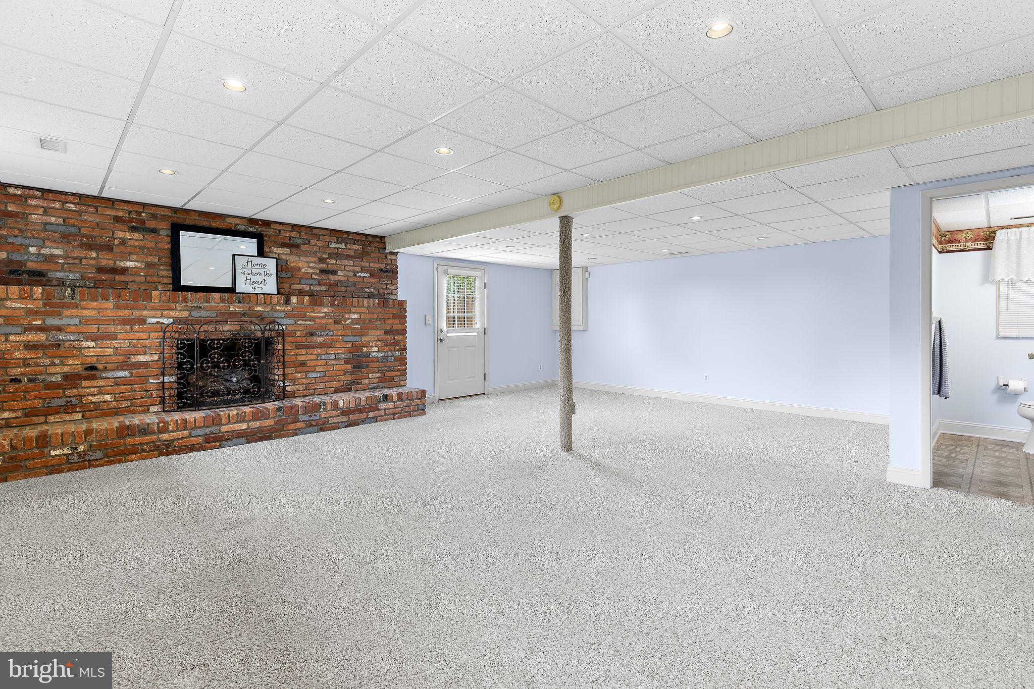 1404 Ryan Road Fallston, MD 21047 - Photo 29 of 50 Lower level rec room w/wood burning fireplace
