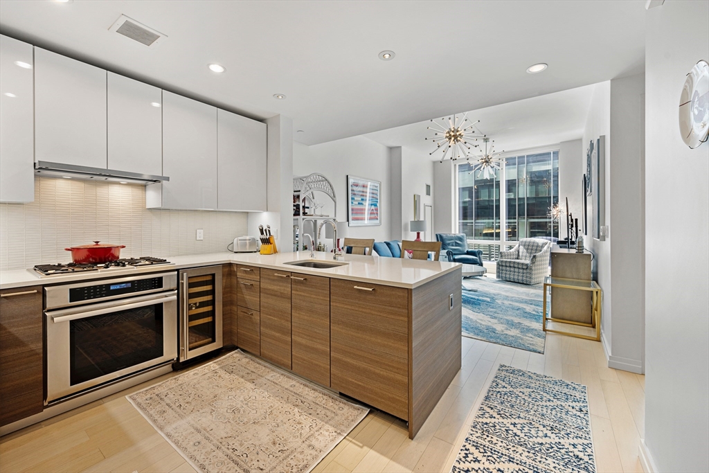a kitchen with stainless steel appliances granite countertop a stove and a sink