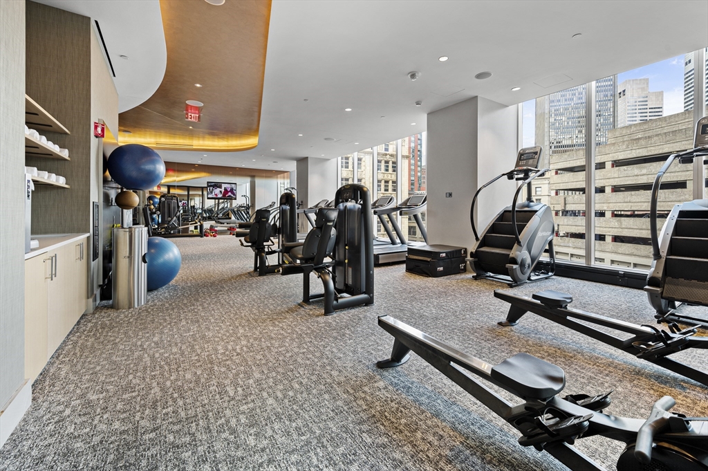 1 Franklin Street, Unit 1002 Boston, MA 02110 - Photo 13 of 21 a view of a room with gym equipment