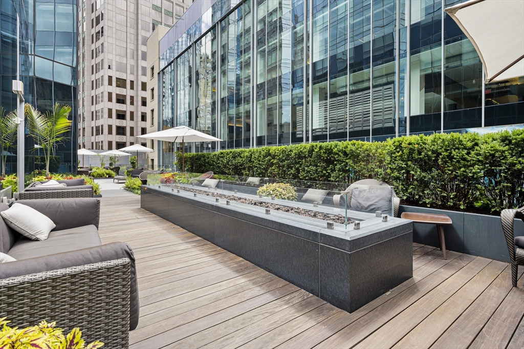 1 Franklin Street, Unit 1002 Boston, MA 02110 - Photo 20 of 21 a view of outdoor kitchen with seating space