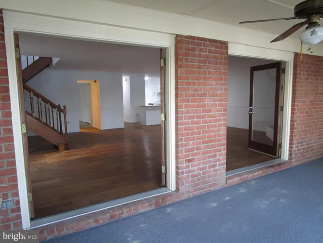 a view of a kitchen with a sink and a window