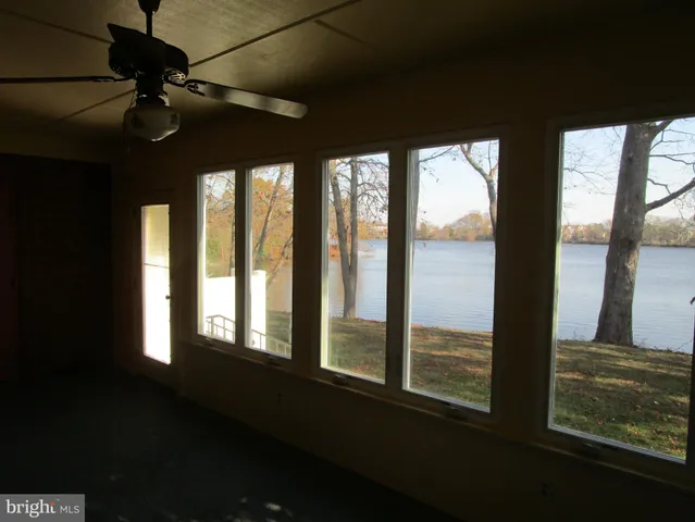 a view of entryway with wooden floor and stairs