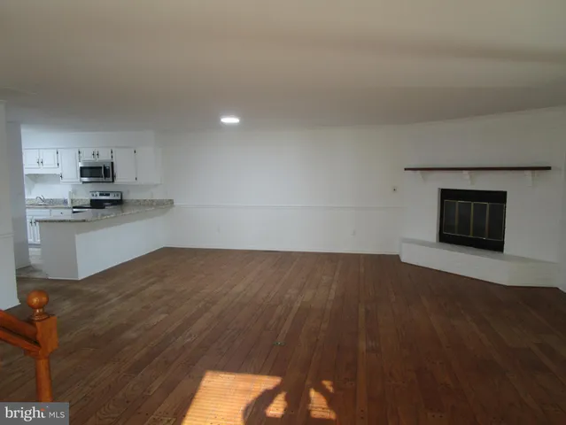 a kitchen with stainless steel appliances a sink stove and window